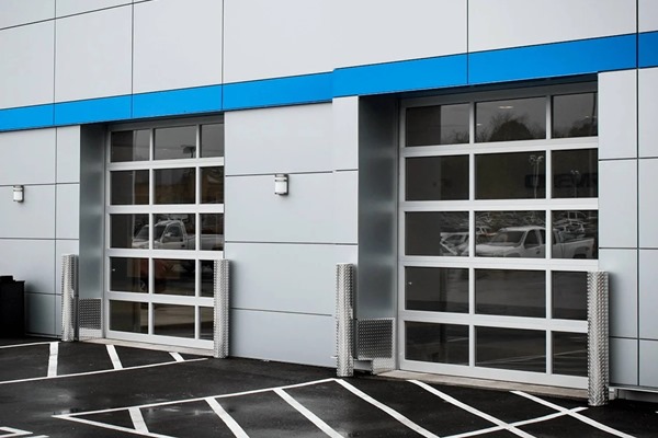 Glass aluminum garage doors on car dealership building