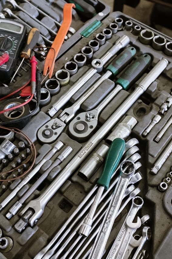 Toolkit with wrenches, nuts, pliers and more for DIY garage repair work